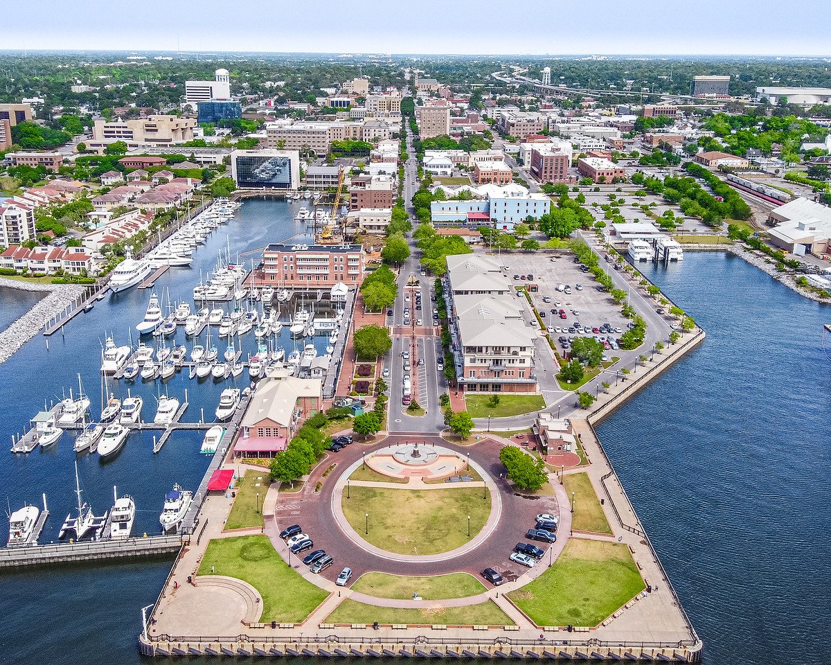 Coastal cityscape with boats and park—Lucky's Pressure Washing